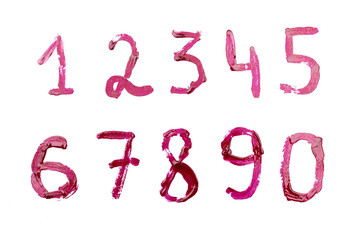 A collection of figures painted with red nail varnish isolated on white background.