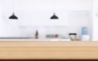 Empty wooden table and blurred background of abstract in front of coffee shop or restaurant for display of product or for montage