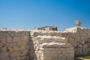 Destroyed stone white wall.