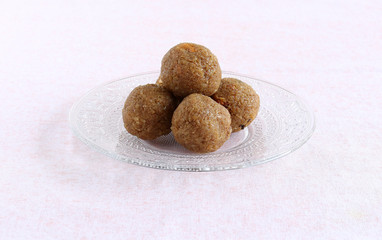 Coconut laddu, an Indian, traditional, popular, vegetarian and delicious sweet dish, is made on festival days like Ganesh Chaturthi, Dussehra and Diwali.