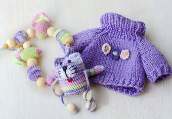 Knitted striped handmade crafted cat.