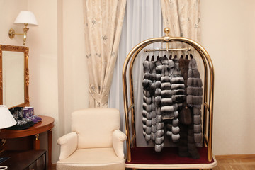 Luxury coats of natural fur chinchilla, sable and mink in the boutique