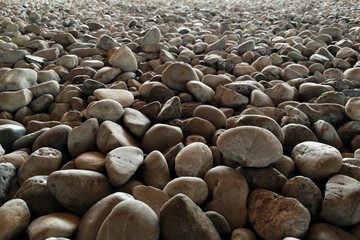 gravel on ground construction material for reference. ground and sub base layer of floor. river stone smooth curve edge stone.