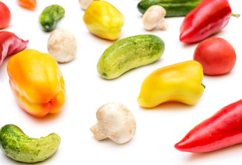 Background from different vegetables on white.