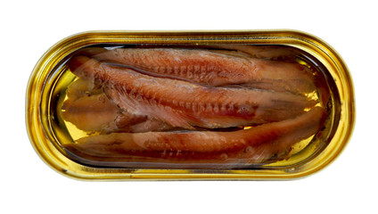 Fillet of anchovies with oil in a yellow oval tin can, close up, top view, isolated on white...