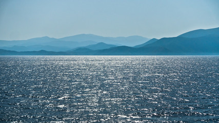 Panorama of North Aegean sea at the entrance to Volos bay on a sunny summer afternoon in Greece