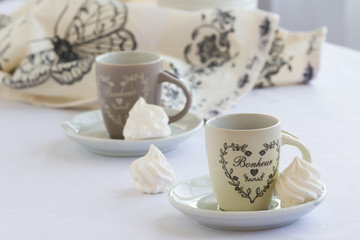 Coffee and meringue, light Italian breakfast, white background