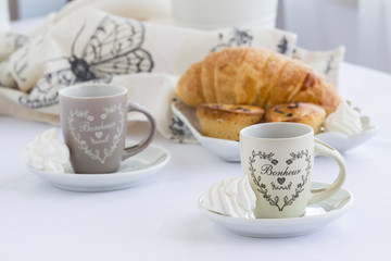 Croissant and a cup of delicious coffee, southen italian traditional sweet breakfast, sweet dessert, bright background