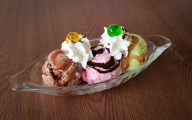 ice cream in glass on wooden table