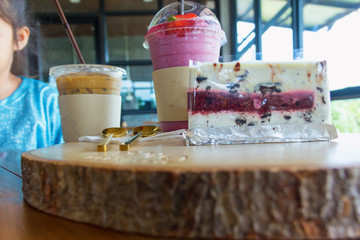 blueberry cake on chopping block in cafe