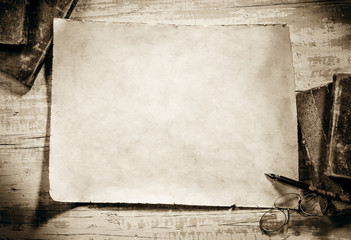 old parchment on antique writing desk,sepia image