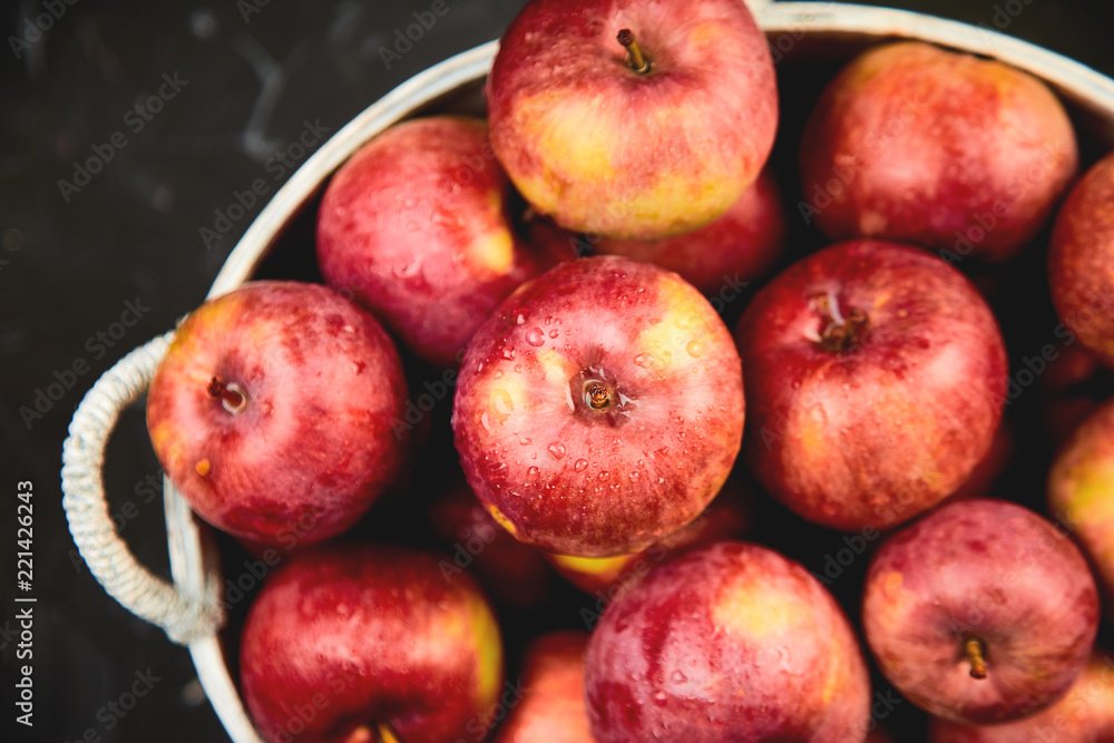 Wall mural fresh organic red apples in a basket