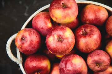 Fresh organic red apples in a basket