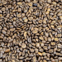 The roasted coffee beans lie on the table. Arab coffee beans. Morning coffee.