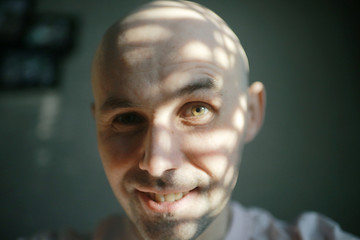 laughs bald guy, cheerful man, smile brutal guy, funny joyful portrait, happy man