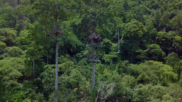Aerial View of Tourists Riding on Zipline or Canopy Rope. Adrenaline Adventure on Vacation