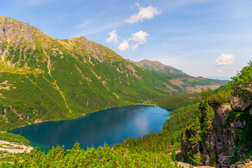 View from the mountain to the beautiful scenic Lake Morskie Oko on a sunny summer day © kosmos111