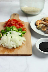 Preparing ingredients for arroz negro - black rice