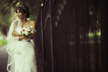 Bride in a white dress at a wedding is beautifully solemn