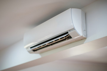 Close up of an Air Conditioner on a white wall - obrazy, fototapety, plakaty