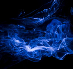 Blue smoke on black background