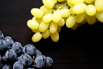 bunch of grapes on black background