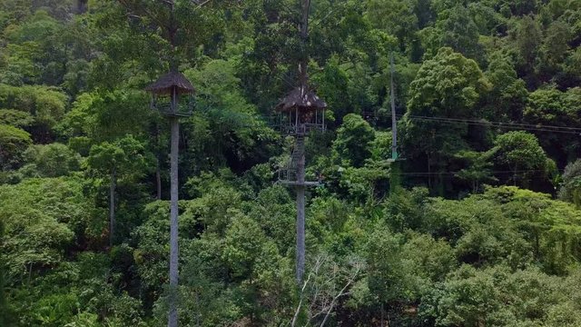 Aerial View of Tourists Riding on Zipline or Canopy Rope. Adrenaline Adventure on Vacation