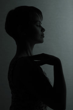 Silhouette of a girl with short hair studio portrait