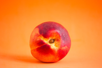 Nectarines on a colored background