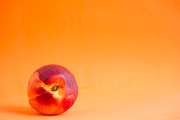 Nectarines on a colored background
