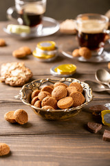 Vintage metal bowl with traditional sweets kruidnoten, pepernoten for the Dutch holiday 'Sinterklaas'. Festive concept with copy space.