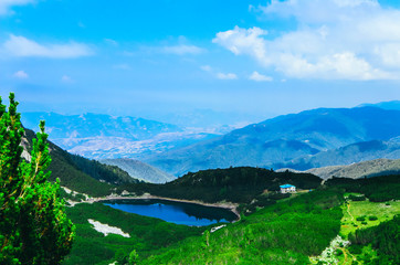 Fototapeta na wymiar Amazing alpine mountain landscape, cottage and lake. Europe, Bulgaria, Pirin mountains.