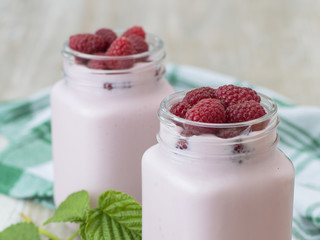 raspberry yogurt on a wooden background. 