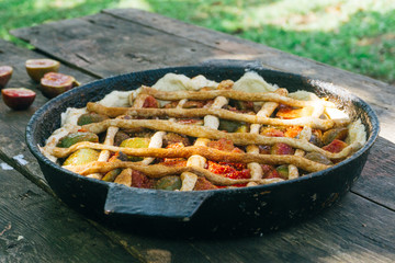 Autumn fig pie or tart with cinnamon on an old wooden table. Top view