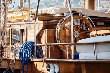 Fototapeta premium Closeup of a vintage hand wheel on a wooden sailing yacht.