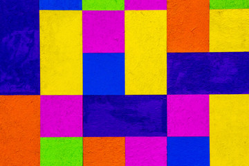 Colourful background block pattern painted on wood