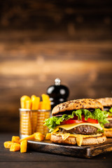 Delicious grilled burgers © George Dolgikh