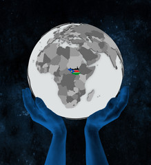 South Sudan on globe in hands