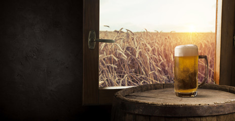 Beer barrel with beer glasses on table on wooden background