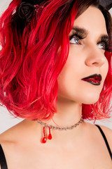 Fototapeta premium Red-haired model with horns. Halloween