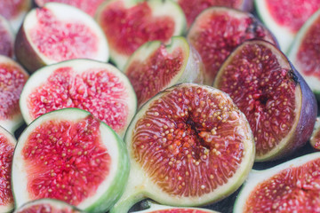 Fresh red figs background on an old wooden table. Top view. Close up