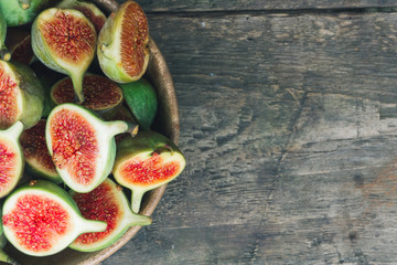Some fresh red figs in a wooden bowl. Top view. Close up