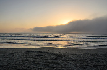 Beach of Black Sea from Mamaia, Romania with water and sand, foggy day