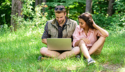 Man and girl looking at laptop screen. Closer to nature. Modern technologies give opportunity to be...