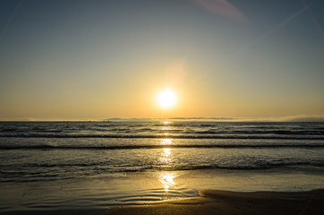 Beach of Black Sea from Mamaia, Romania at sunrise , warm sunshine atmosphere