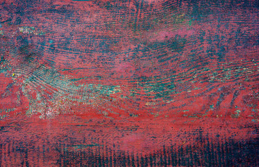Texture of shabby wood, with multi-colored layers of paint. Close-up. Old background