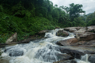 Waterfalls flowing down from the stream at "Mae Wang" waterfalls in Chiangmai, Thailand