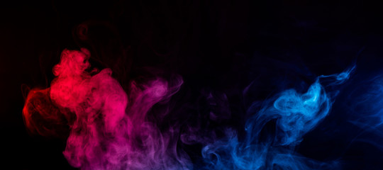 abstract shapes of mixed colors of blue and red smoke at dark background