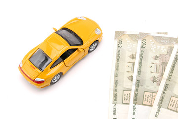 indian currency notes and toy car in the hands bank loan concept 