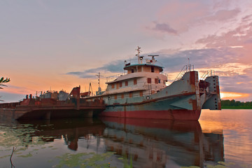 The old tugboat is on the pier. Kostroma, Russia.